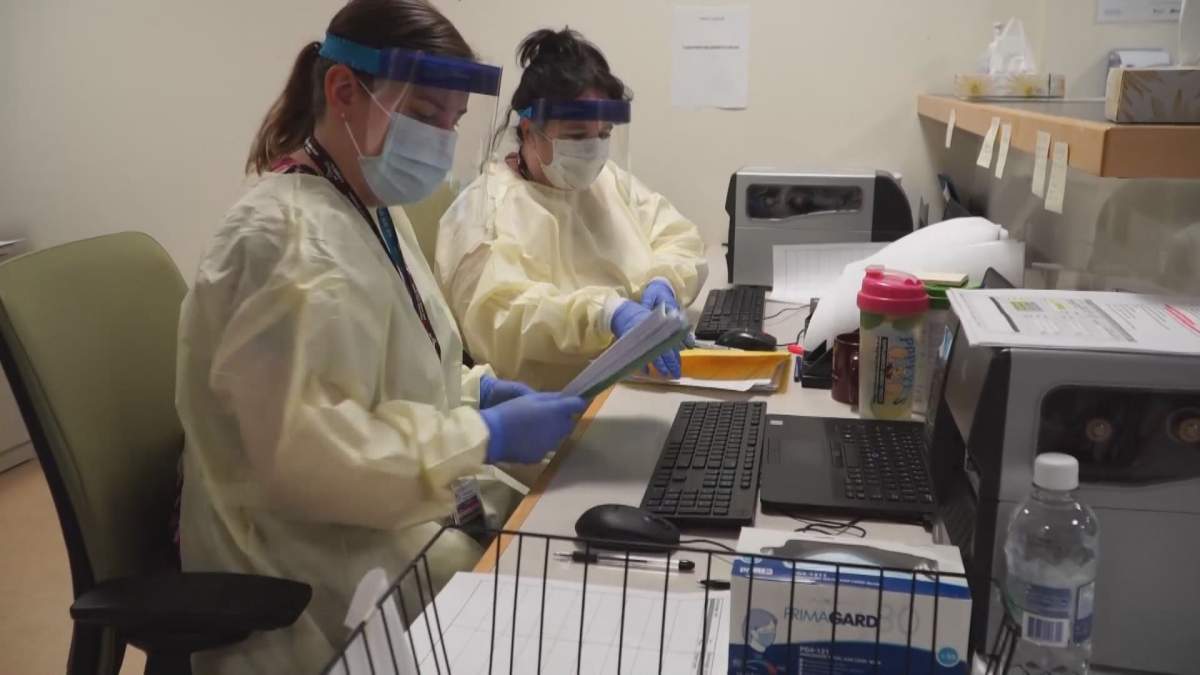 Nurses wear personal protective equipment in an Alberta hospital. 