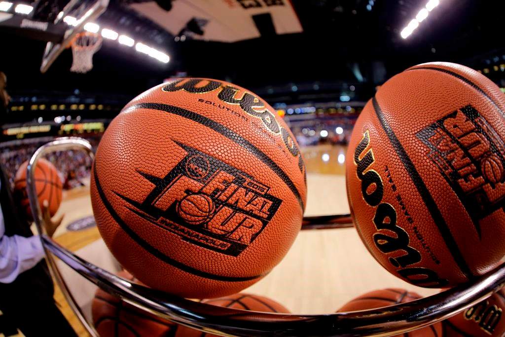 FILE - In this April 3, 2015, file photo, basketballs sit in a rack.