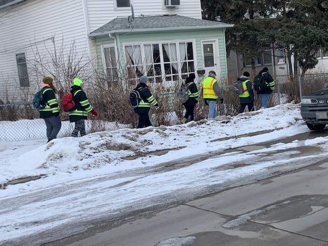 Bear Clan members patrol the Elmwood and Chalmers neighbourhoods on Tuesday night.