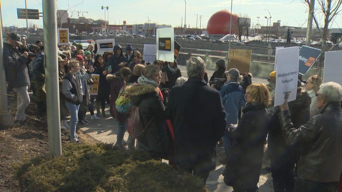Protesters demand the shut down of Pornhub at the MindGeek headquarters in Montreal on March 8, 2020.