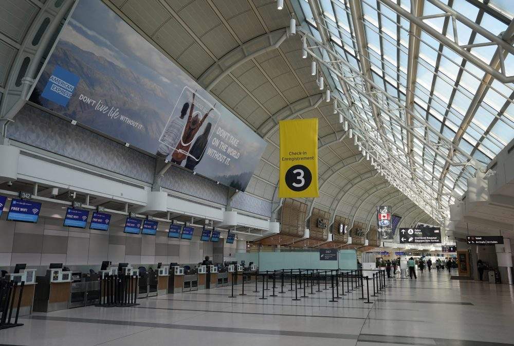 An almost-empty Terminal 3 is shown at Pearson International Airport in Toronto, Friday, March 13, 2020.