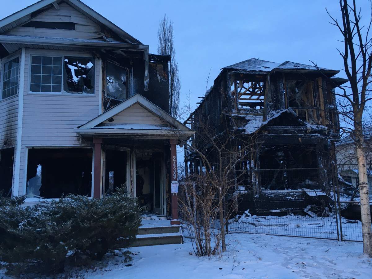 Two homes were destroyed and the neighbouring houses damaged after a fire broke out late Tuesday night in the 2400 block of Riverstone Road SE in Calgary’s Riverbend neighbourhood.