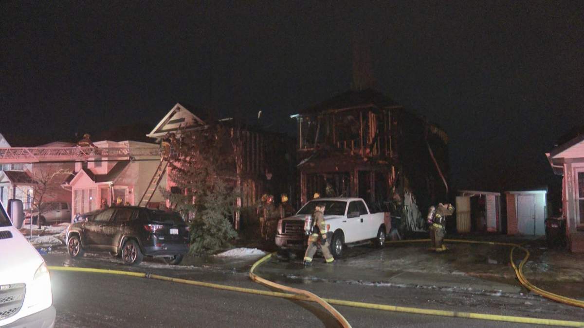 Two homes were destroyed and the neighbouring houses damaged after a fire broke out late Tuesday night in the 2400 block of Riverstone Road SE in Calgary’s Riverbend neighbourhood.