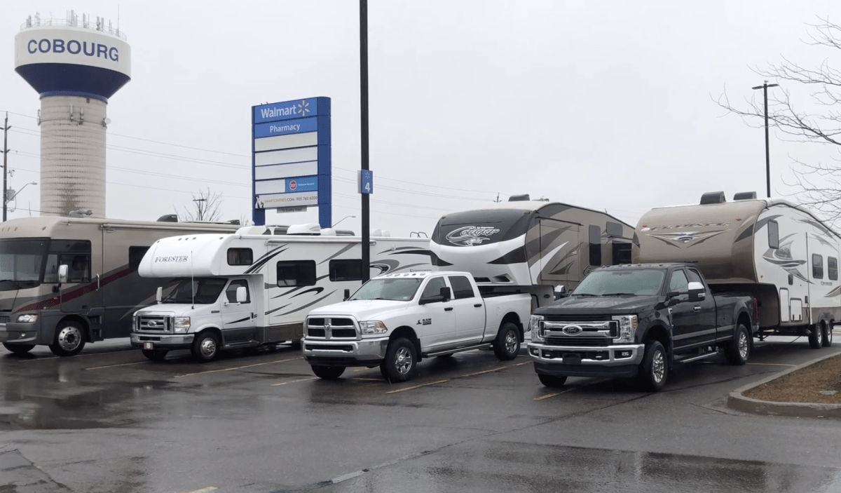 Vehicles parked outside a Walmart in Cobourg, Ont., on Monday. 