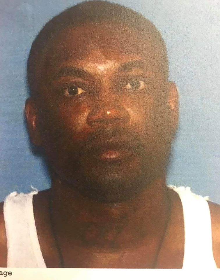 Travis Santay Lewis, 39, is shown in this handout photo.