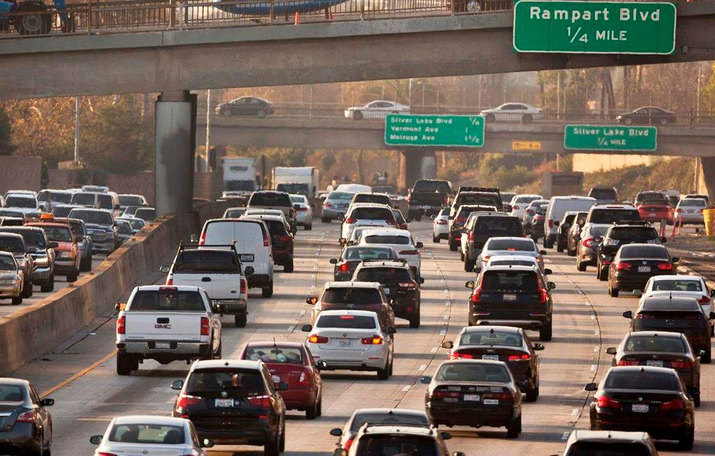 FILE - This Dec. 12, 2018, file photo shows traffic on the Hollywood Freeway in Los Angeles. President Donald Trump's is expected to mark a win in his two-year fight to gut one of the United States' single-biggest efforts against climate change, relaxing ambitious Obama-era vehicle mileage standards and raising the ceiling on damaging fossil fuel emissions for years to come. (AP Photo/Damian Dovarganes, File).
