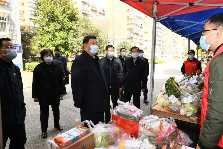 Chinese President Xi Jinping inquires about the purchase and supply of people’s daily necessities at a community in Wuhan, central China’s Hubei Province, March 10, 2020.