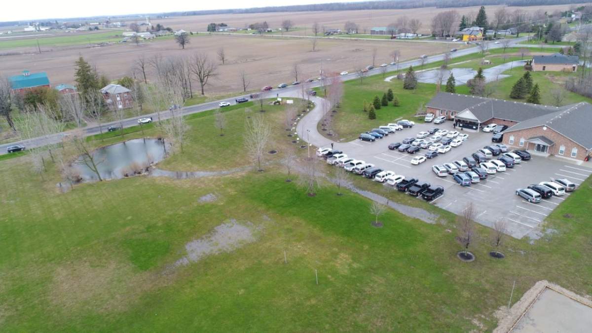 An aerial image captures a full parking lot at the Church of God in Aylmer, Ont., as drive-in church service takes place Sunday, April 26, 2020.