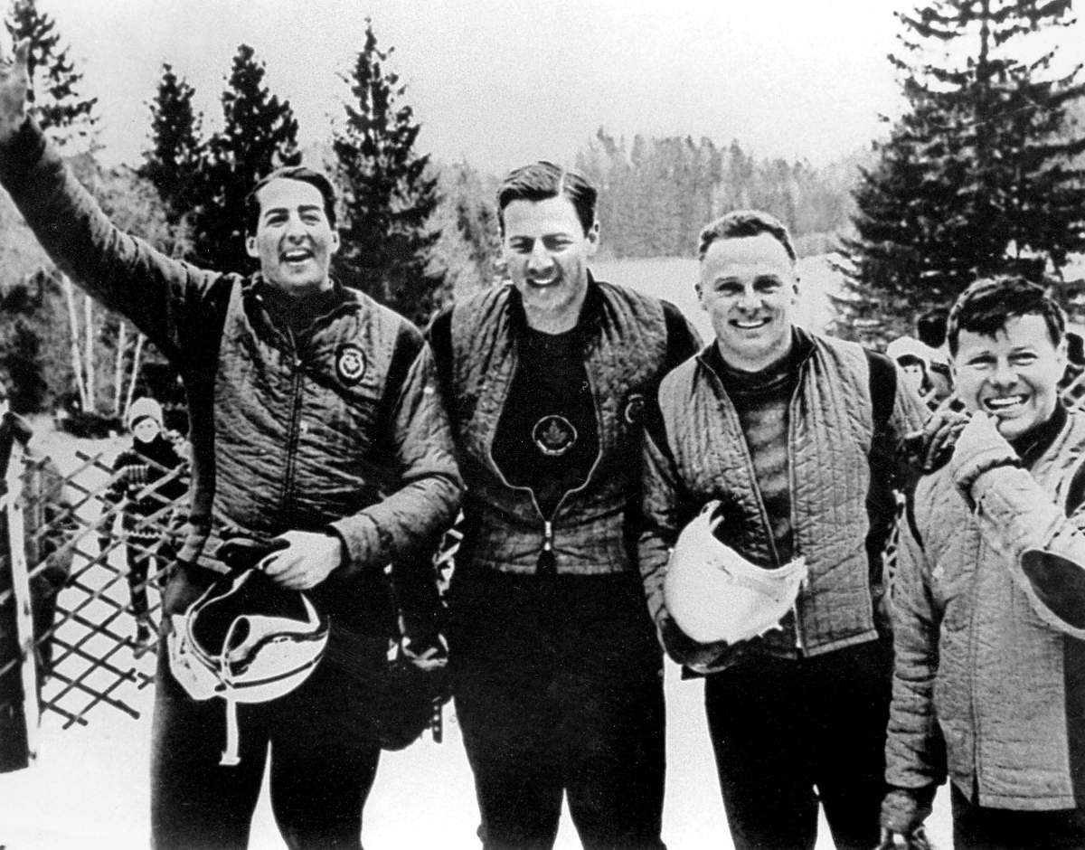 Canada’s four-men bobsleigh team, Doug Anakin, Vic Emery, John Emery and Peter Kirby, celebrates its gold medal performance at the 1964 Innsbruck winter Olympics.
