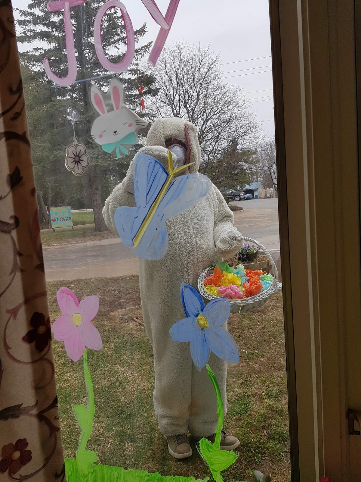 The Easter Bunny waved outside to residents at the Pinecrest Nursing Home in Bobcaygeon, Ont. on Sunday, April 12.