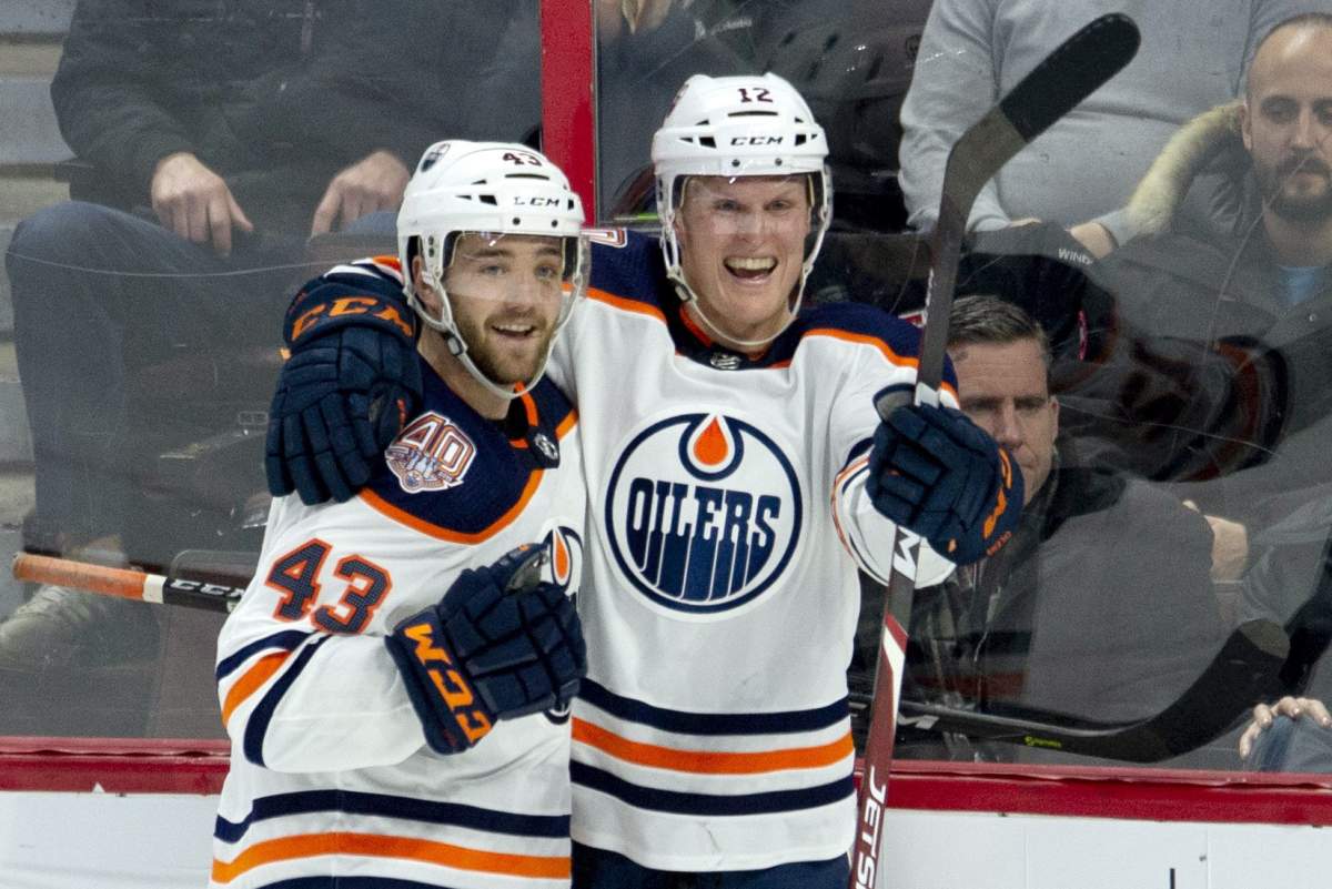 Edmonton Oilers centre Colby Cave(12) celebrates his goal with teammate Josh Currie during third period NHL action against the Ottawa Senators, in Ottawa, Thursday, Feb. 28, 2019. The Oilers defeated the Senators 4-2.
