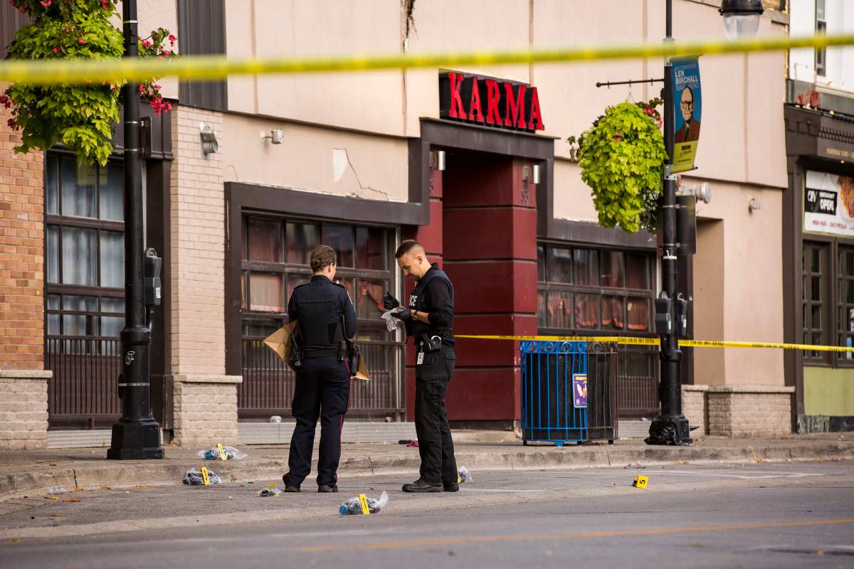 Niagara Regional Police Service officers investigate a shooting that took place early Sunday in the area of the Karma nightclub on St. Paul Street in St. Catharines, Ont., Sunday, Sept. 29, 2019.