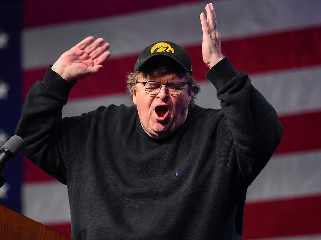 U.S. filmmaker Michael Moore addresses supporters of Senator Bernie Sanders at the Bernie 2020 Caucus Concert at Horizon Events Center in Clive, Iowa, on Jan. 31, 2020. 