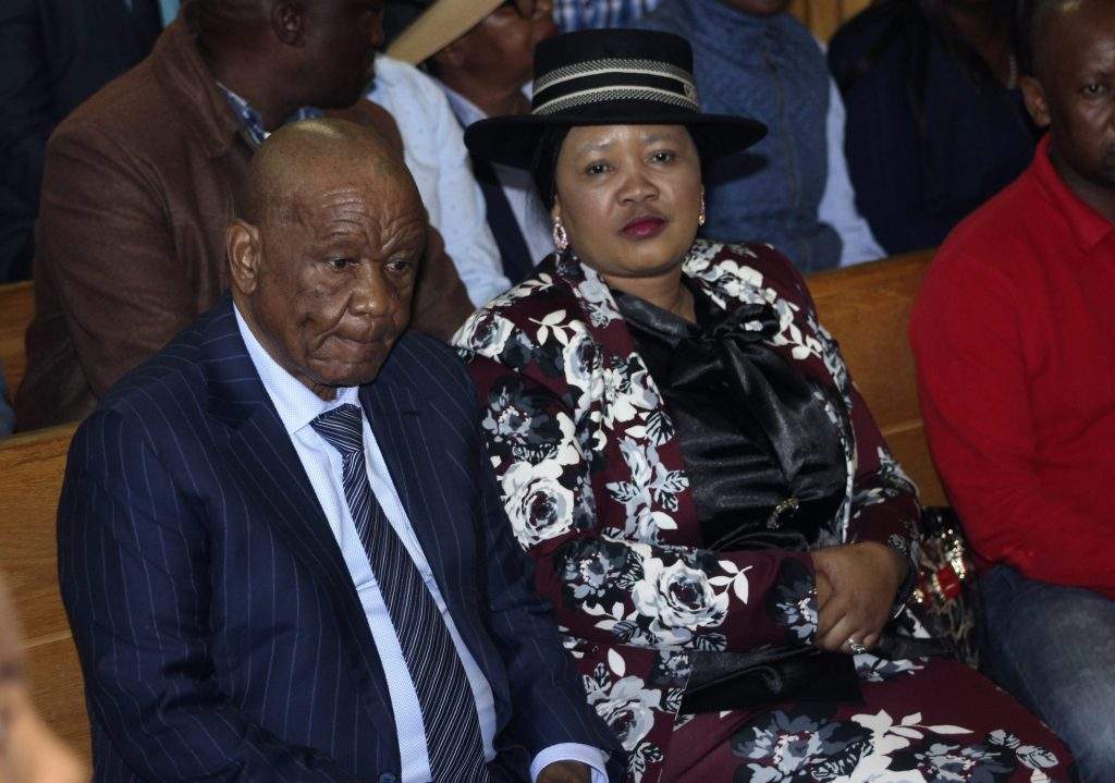 Lesotho\’s Prime Minister, Thomas Thabane, left, and his wife Maesaiah, right are seated in court, in Maseru, Monday, Feb. 24, 2020.