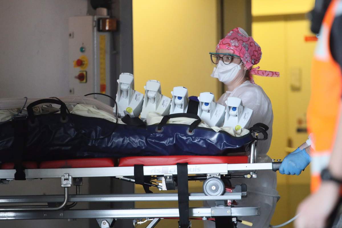 A medical staff takes care of a patient from Paris and infected with the COVID-19 virus, admitted in a hospital April 5, 2020 in Rennes, western France.