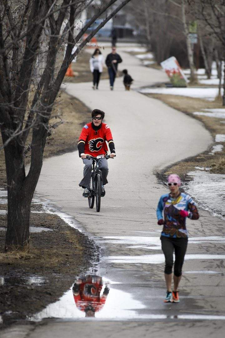 People step outside in Calgary on Thursday, April 9, 2020, amid the COVID-19 pandemic.
