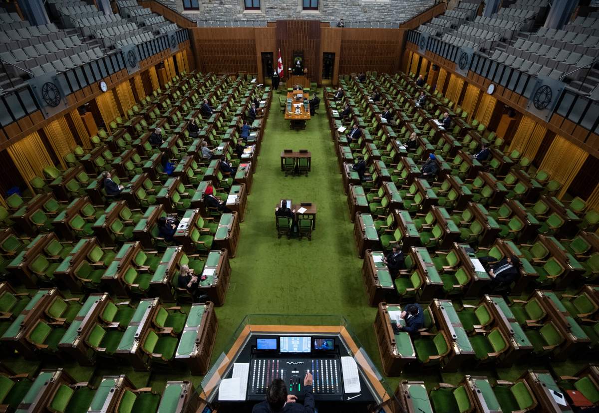 Members of Parliament, attending in limited numbers and seated apart to practice physical distancing, wait for proceedings to begin in the House of Commons on Parliament Hill in Ottawa, as Parliament was recalled for the consideration of measures related to the COVID-19 pandemic, on Saturday, April 11, 2020. 