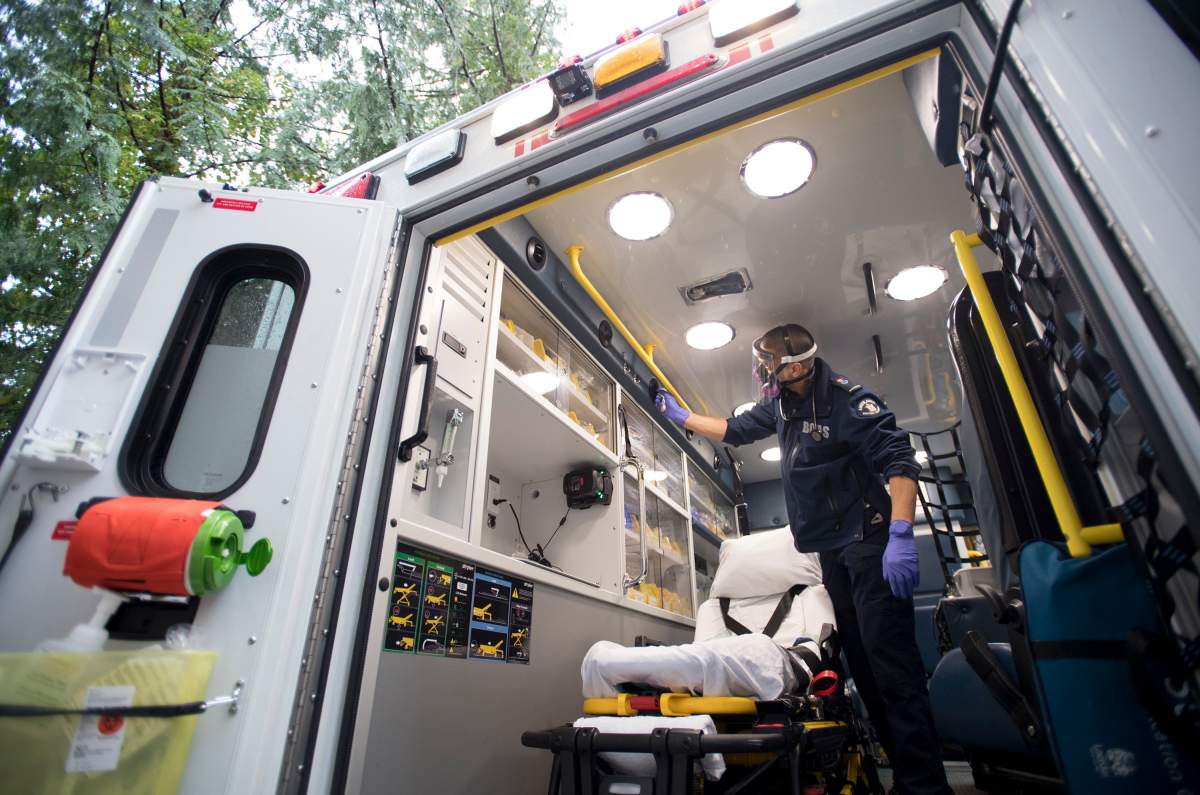 B.C. Ambulance paramedic Jeff Booton cleans his ambulance at station 233 in Lions Bay, B.C. Wednesday, April 22, 2020. 