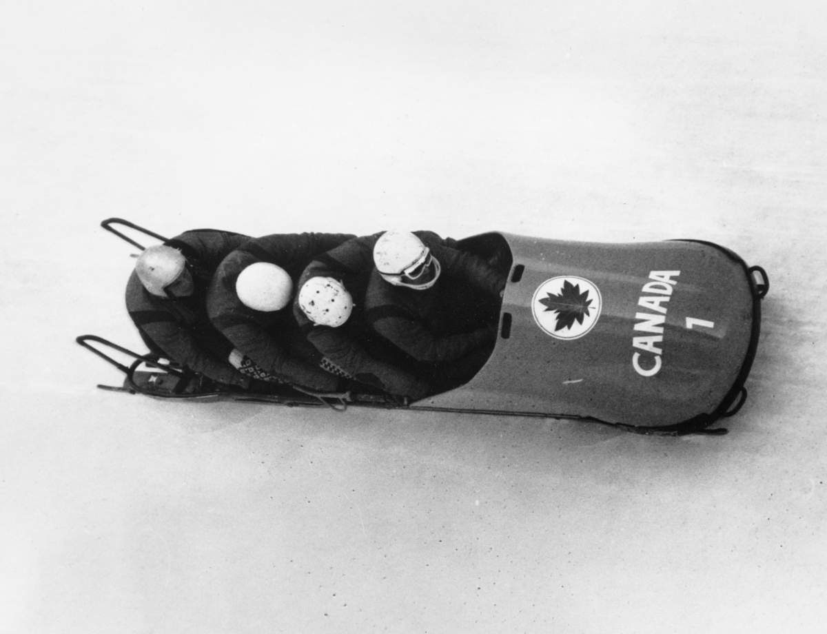 The Canadian four man bobsled team in the Winter Olympic event in the third run at Igls, Austria, Feb. 6, 1964. Front to back; Piloted by Victor Emery, Douglas Anakin, John Emery, and Peter Kirby. Douglas Anakin, who helped Canada win Olympic bobsled gold in 1964, has died at age 89. Anakin, Peter Kirby and brothers John and Vic Emery claimed four-man gold at the 1964 Winter Olympics in Innsbruck, Austria.