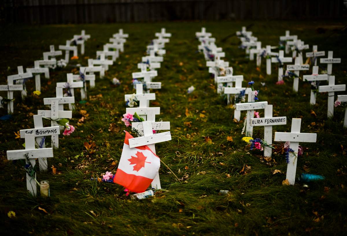 Crosses are displayed in memory of the elderly who died from COVID-19 at the Camilla Care Community facility during the pandemic in Mississauga, Ont., on Thursday, Nov. 19, 2020. Ontario has entered the second wave of coronavirus infections.