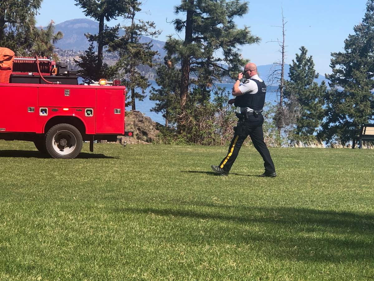 An RCMP officer on scene of a suspicious grass fire at Bertram Creek Regional Park in Kelowna.