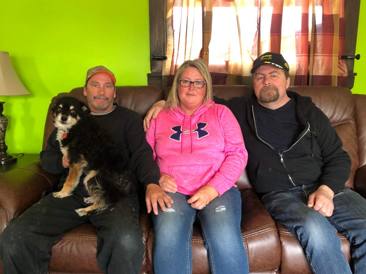 Greg and Jamie Blair’s family members (left to right) Shawn Rushton, Kelly Blair, and Steve MacKinnon, mourn their loved ones from home in Truro, N.S. on April 22, 2020.