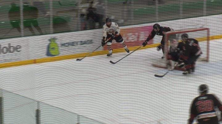 Saskatoon Contacts forward Brayden Yager looks to make a pass during a playoff game against the Moose Jaw AAA Warriors .