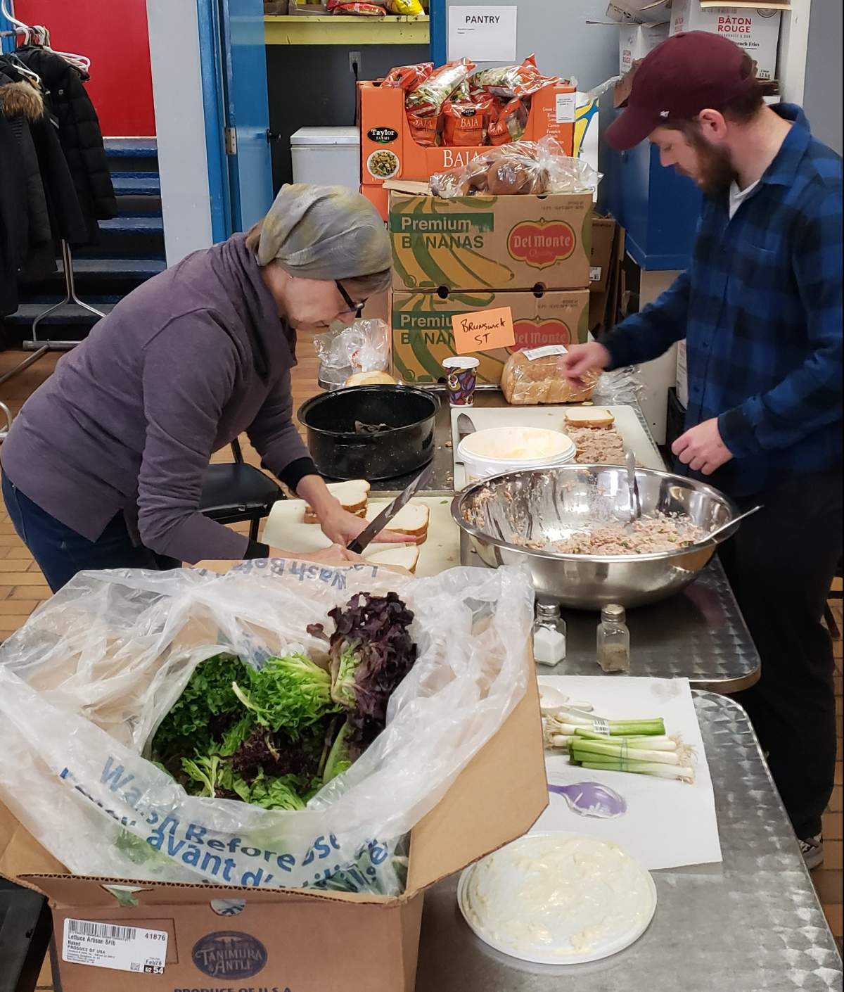 Volunteers at Brunswick Street Mission prepare meals.