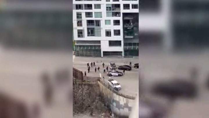 A screenshot of a video posted on Twitter just before a Toronto police cruiser appeared to drive over a fleeing suspect on Front Street West.