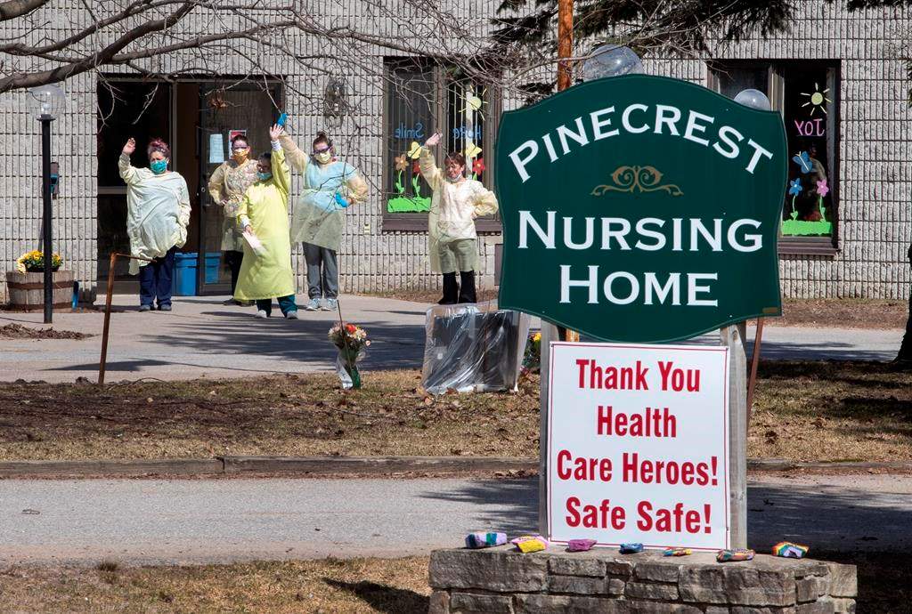 Nurses wave to hundreds of residents driving by Pinecrest Nursing Home honking their horns to acknowledge health-care workers in Bobcaygeon, Ontario on Wednesday April 1, 2020.