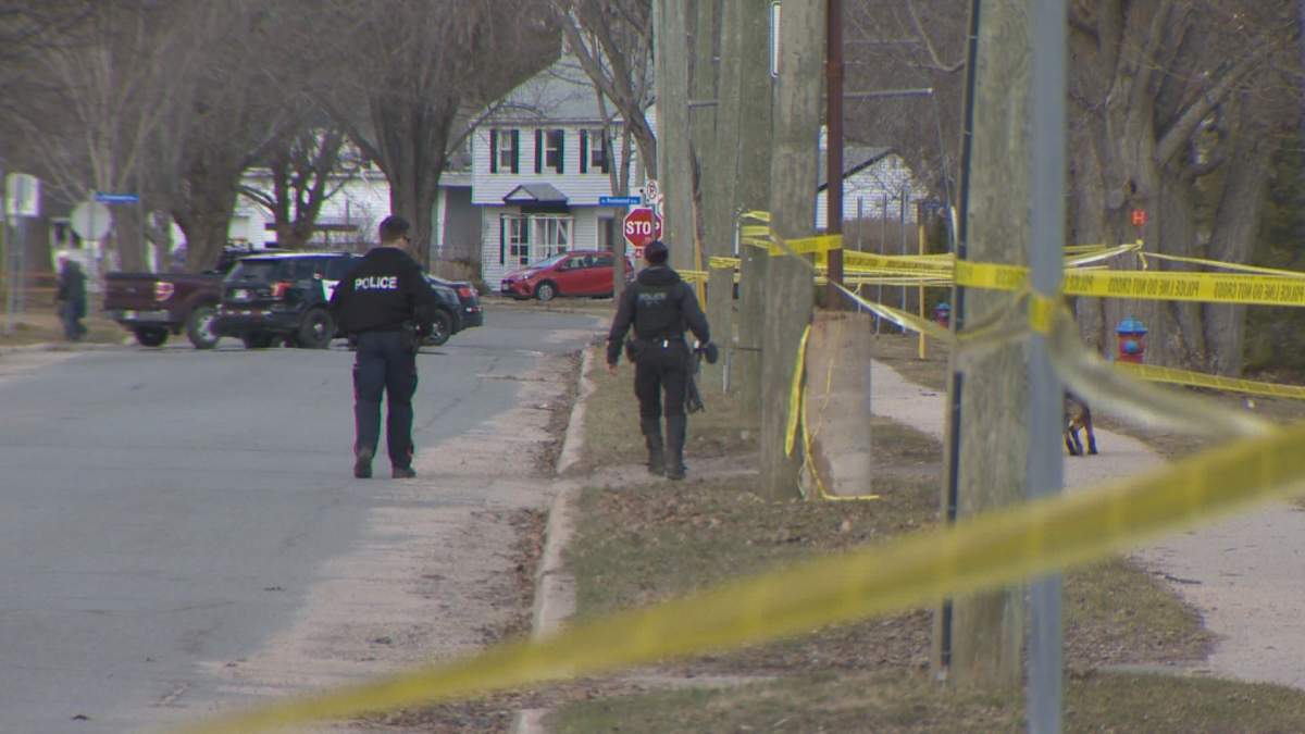 Investigators attend the scene of a homicide in Fredericton on Wednesday, April 15, 2020.