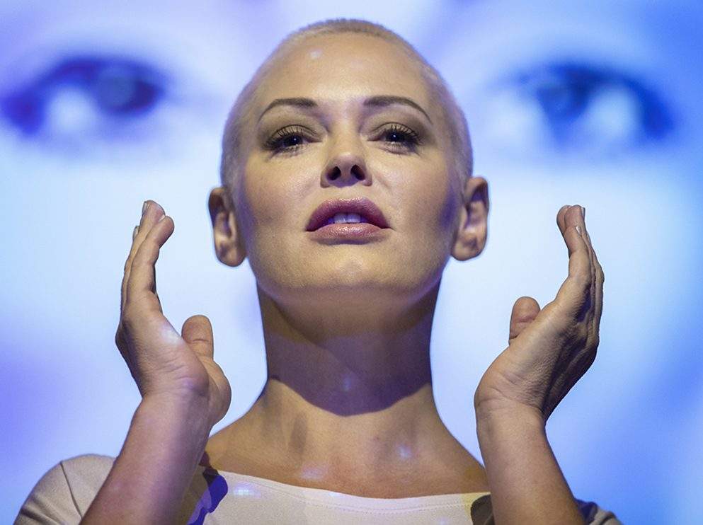 Actress and activist Rose McGowan on stage at the Assembly Hall, Edinburgh, with backdrop projections from her debut stage show 'Planet 9,' which premieres at the Edinburgh Festival.