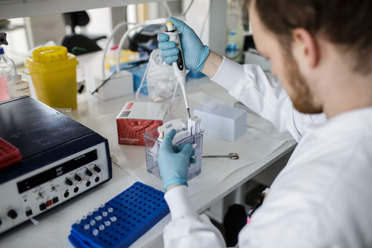 FILE: A researcher works on a vaccine against the new coronavirus COVID-19 at the Copenhagen's University research lab in Copenhagen, Denmark, on March 23, 2020.