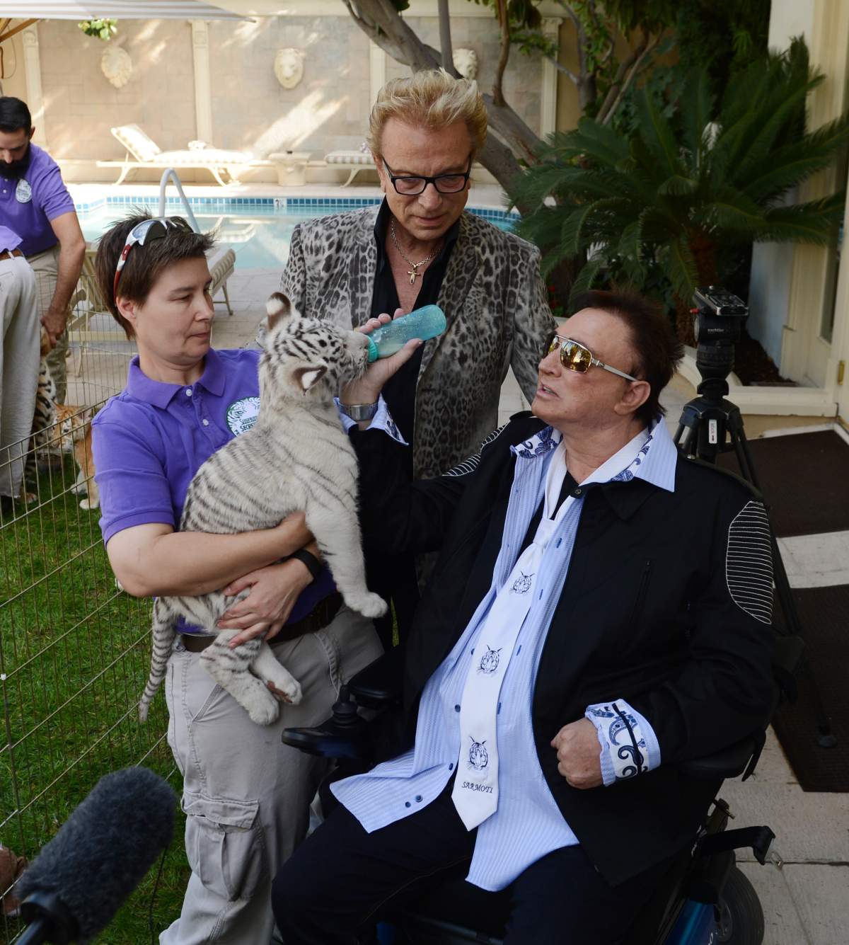 Siegfried Fischbacher and Roy Horn celebrate Sarmoti Cubs day with Make-A-Wish Foundation at The Mirage Hotel & Casino on Oct. 22, 2015 in Las Vegas. (Photo by Denise Truscello/WireImage)