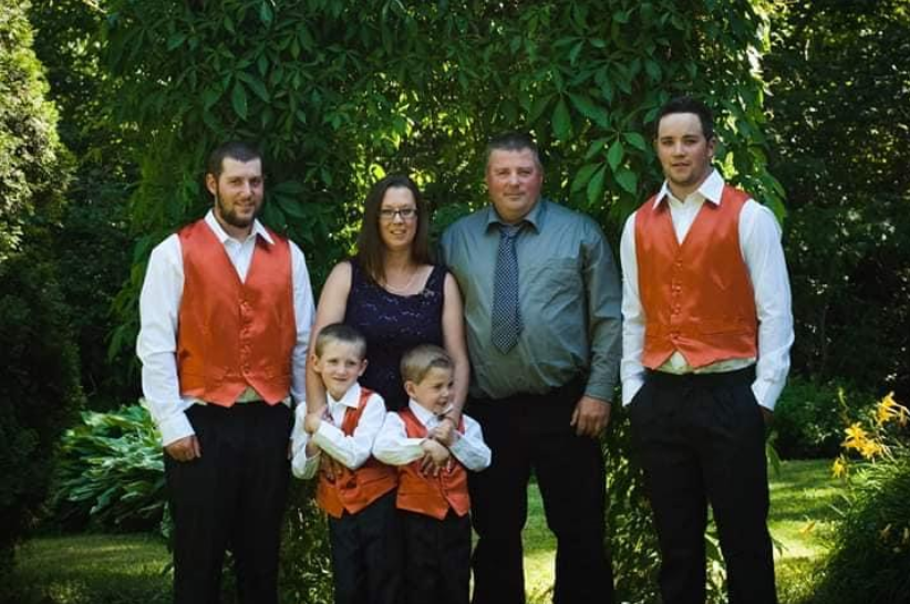Greg and Jamie Blair are seen with their children Tyler, 27, Craig, 24, Alex, 11, and Jack, 10.