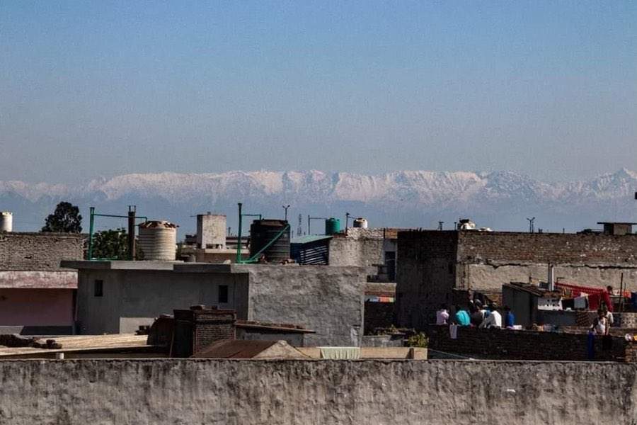 The Himalayas are shown in the distance from Jalandhar in the Indian state of Punjab on April 3, 2020.