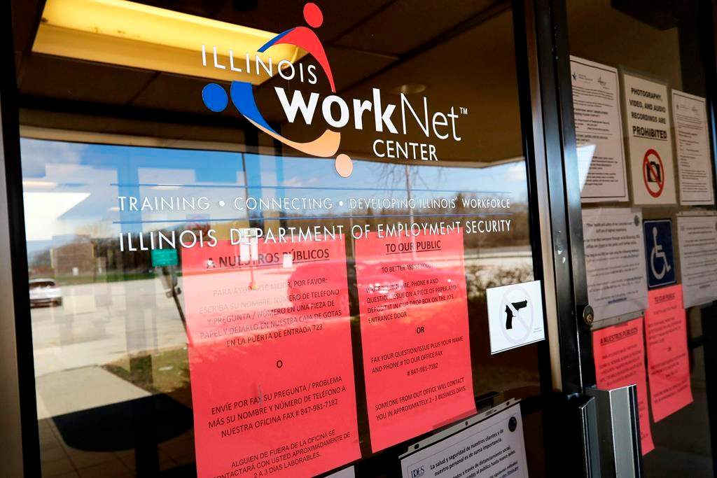 Information papers display at IDES (Illinois Department of Employment Security) WorkNet center in Arlington Heights, Ill., Thursday, April 9, 2020. Another 6.6 million people filed for unemployment benefits last week, according to the US Department of Labor, as American workers continue to suffer from devastating job losses, furloughs and reduced hours during the coronavirus pandemic. (AP Photo/Nam Y. Huh).