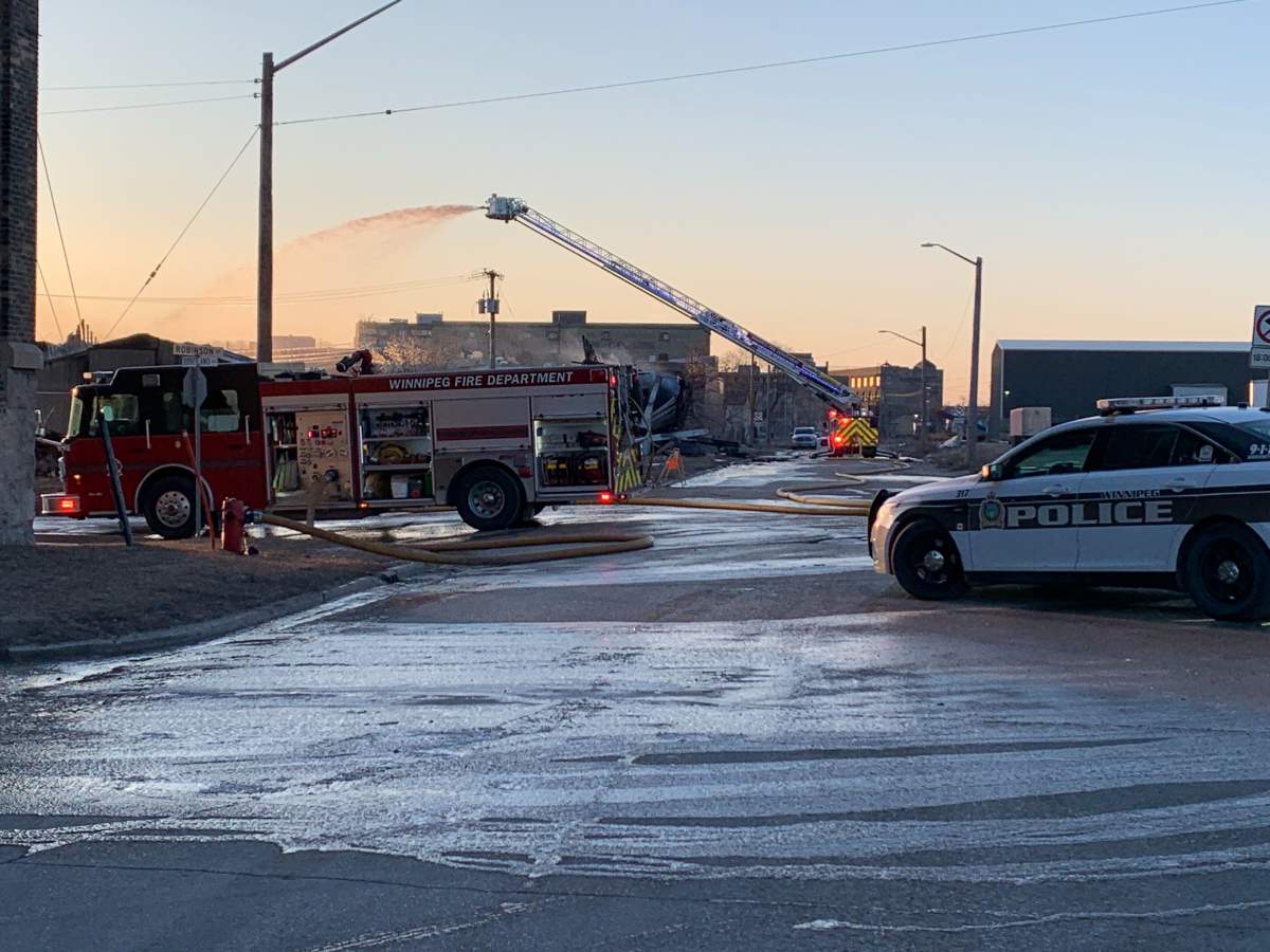 Winnipeg firefighters are putting out hot spots on an early morning Friday blaze in Winnipeg's North End.