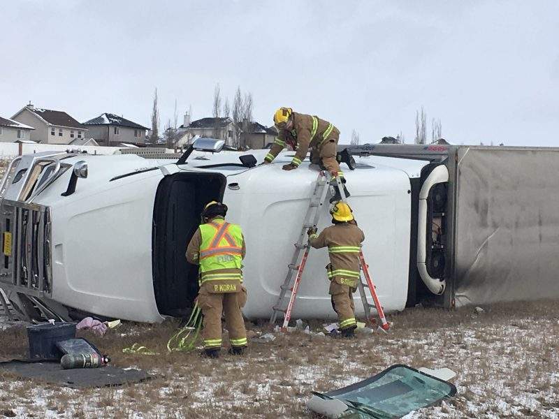 Calgary firefighters respond to a rollover on Stoney Trail Northwest on Wednesday, April 1, 2020
