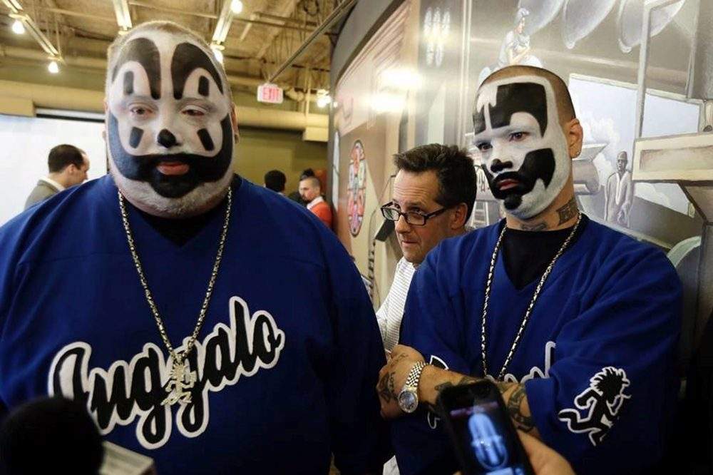 In this Jan. 8, 2014 photo members of rap-metal music group Insane Clown Posse appear at a news conference in Detroit. 