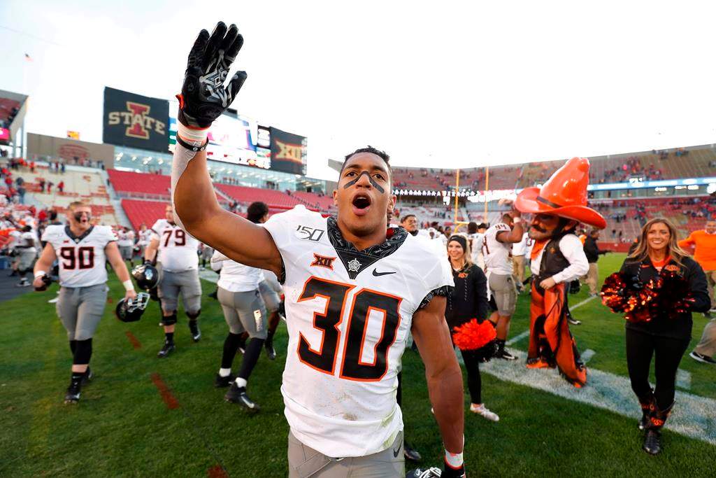 Oklahoma State running back Chuba Hubbard blows a kiss to Oklahoma State fans after their 34-27 win over Iowa State in an NCAA college football game in Ames, Iowa, on Oct. 26, 2019. Canadian Chuba Hubbard will have a tough act to follow this season. His own. The 20-year-old native of Sherwood Park, Alta., was the NCAA rushing leader last season, running for 1,936 yards and 21 TDs. That left the Oklahoma State star eighth in voting for the Heisman Trophy, presented annually to American college football's top player. THE CANADIAN PRESS/AP - Matthew Putney.