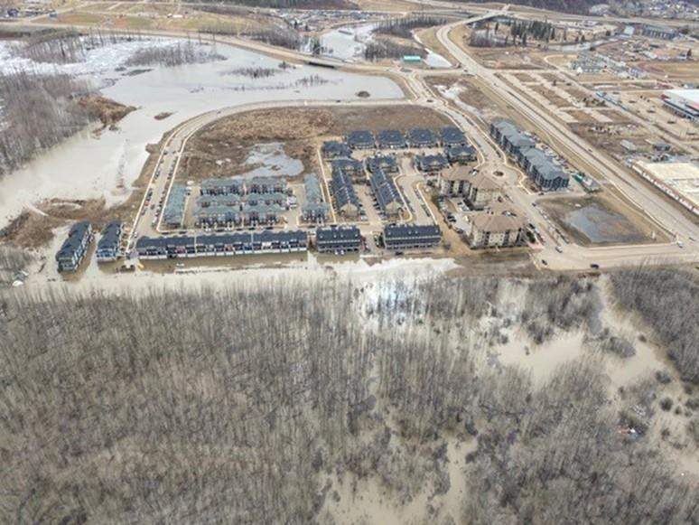 Flooding is seen in the Longboat Landing area of Fort McMurray, Alta. on Sunday, April 26, 2020 in this handout photo. The spring ice breakup on rivers in northern Alberta is forcing some residents of Fort McMurray neighbourhoods from their homes, and people in the city's downtown have been warned to be ready to react in case the evolving situation changes. THE CANADIAN PRESS/HO, Regional Municipality of Wood Buffalo *MANDATORY CREDIT*.