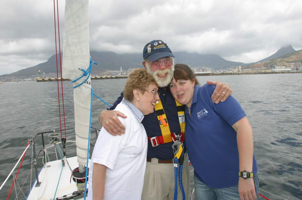 John Dennis is greeted by his wife Penny and daughter Stephanie after competing in an international sailing race in 2002.