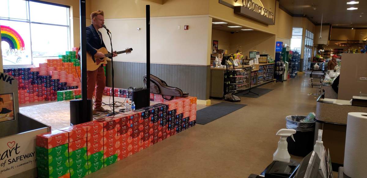 Martin Kerr sings to employees at Heritage Safeway.