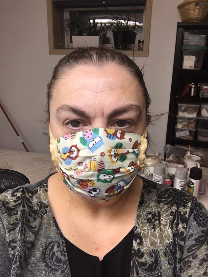 Liz Kischook, pictured with one of her handmade face masks.