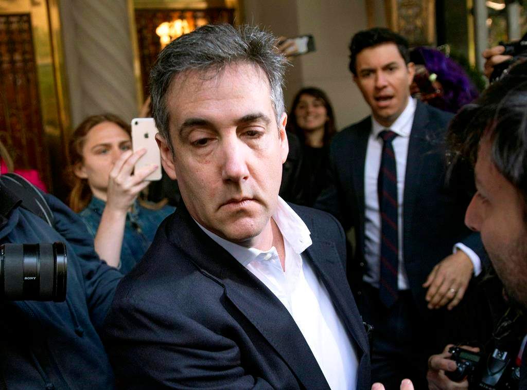 FILE - In this May 6, 2019, file photo, Michael Cohen, former attorney to President Donald Trump, leaves his apartment building before beginning his prison term in New York.