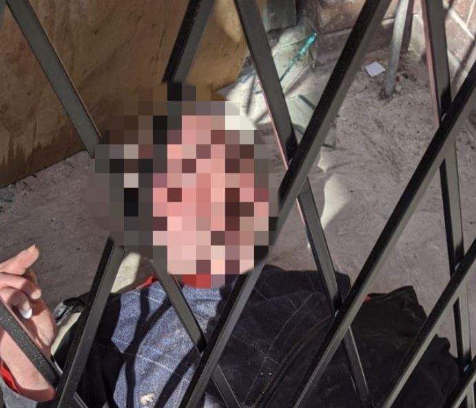 Vancouver police tweeted out this photo of the man trapped in the security gate. His face is blurred because he was not charged with any crime.