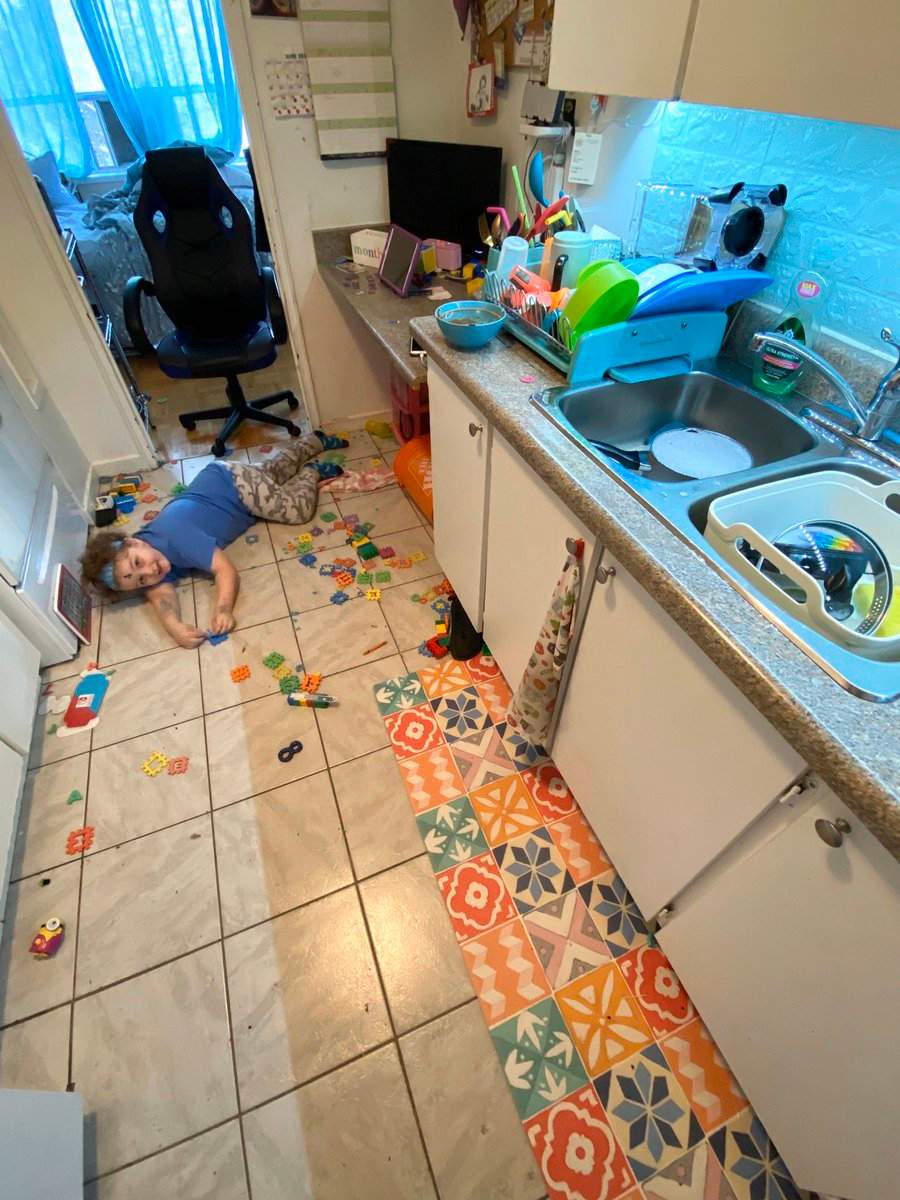 Phoenix plays with toys on the kitchen floor. Photo courtesy of Susan Cosgrove