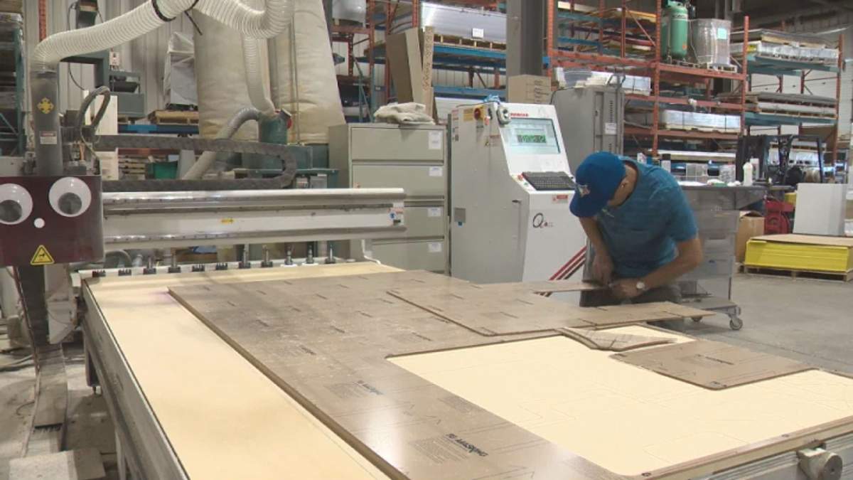 Workers at Plastic Plus Ltd. are in seven days a week to keep up with demand for protective shields for businesses.