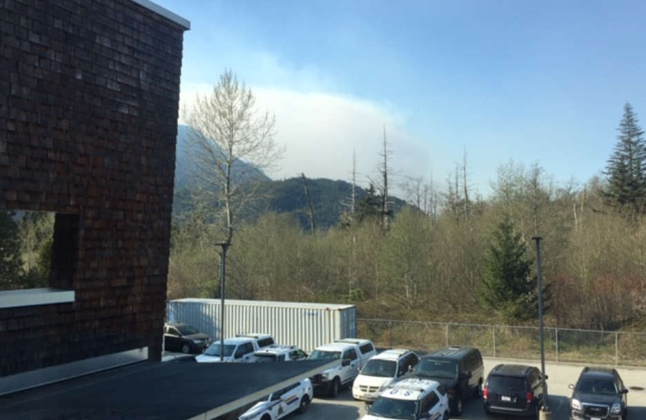 Smoke can be seen from the wildfire north of Squamish. Police say the wildfire was sparked when a slash burn got out of control.